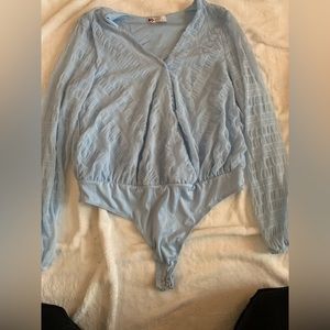 2 body suits, one black, one a light blue. Both XL